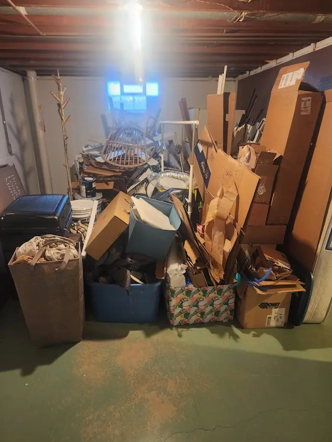 Roll-off dumpster container at job site for 2 Yard Dumpster Rental in Marinette